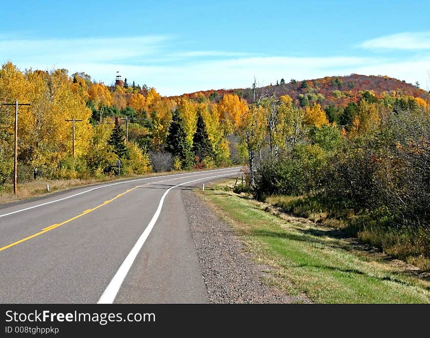 Road through colourful autumn trees. Road through colourful autumn trees