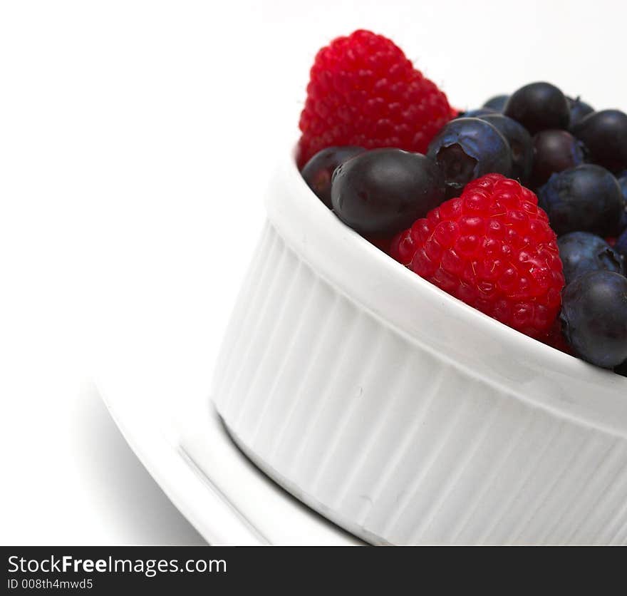 Raspberries and blueberries in a bowl. Raspberries and blueberries in a bowl