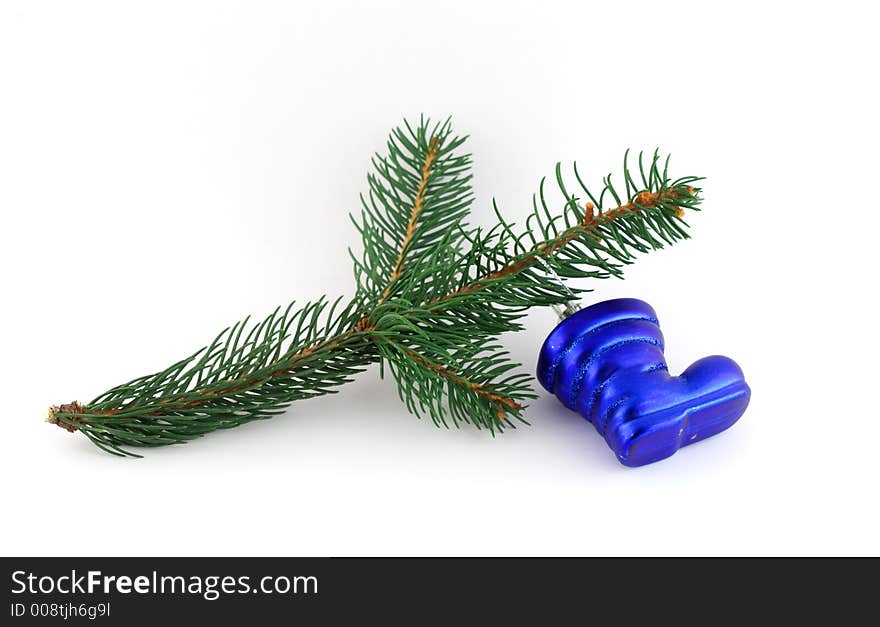 Isolated christmas decoration on white background (Twig and blue boot)