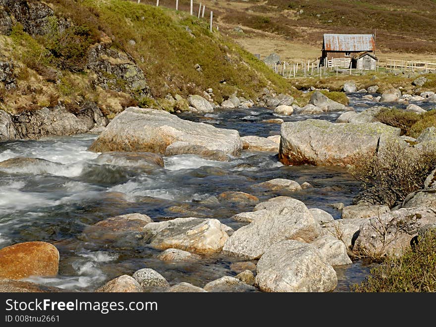 Mountain river and cottage