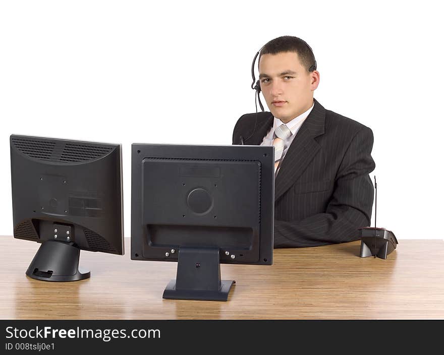 Isolated on white businessman at he computer's screens