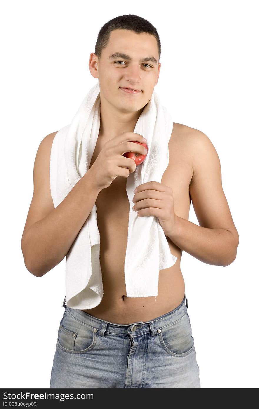 Undressed man with towel and apple