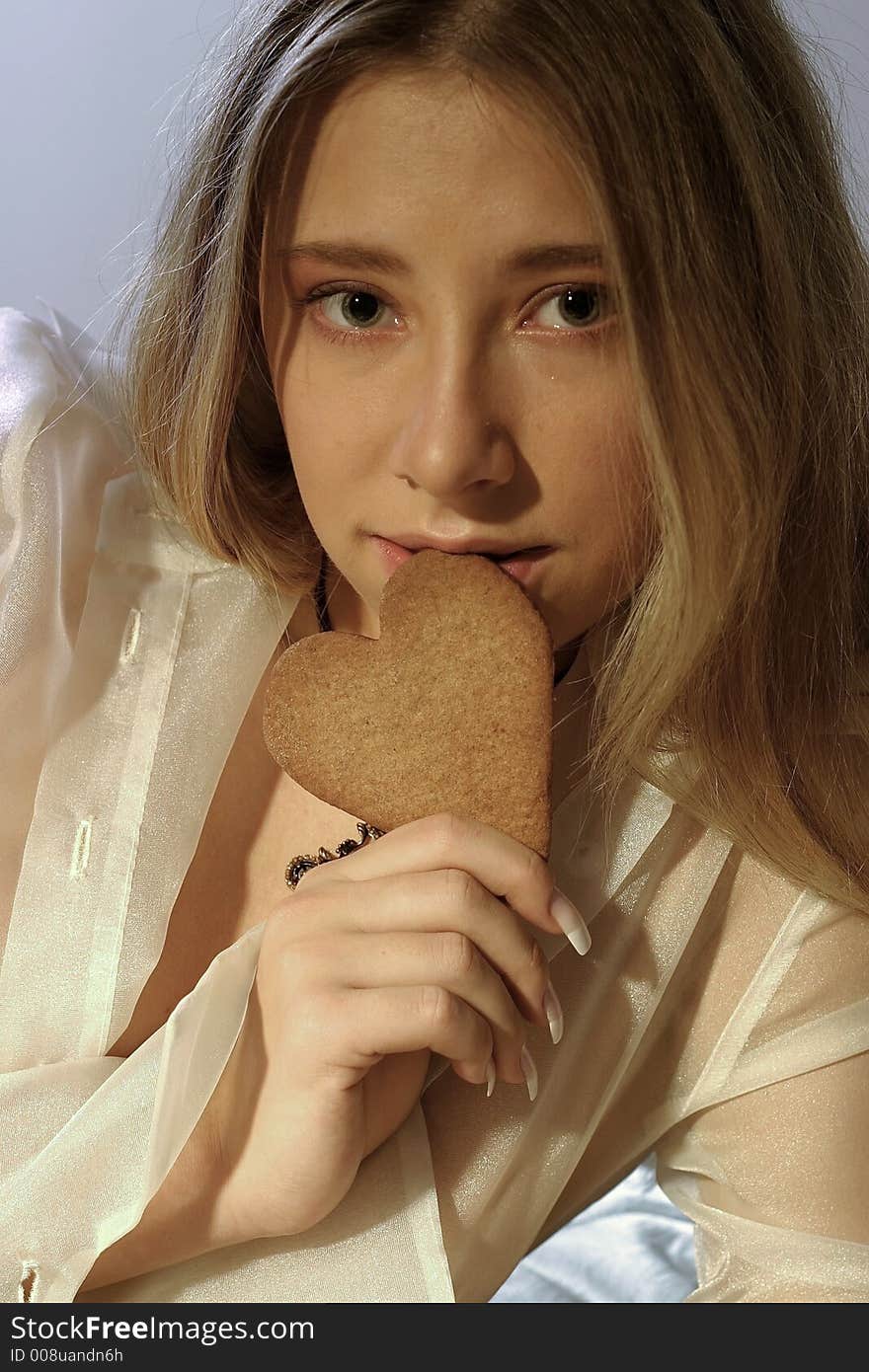 Girl with a ginger bread heart