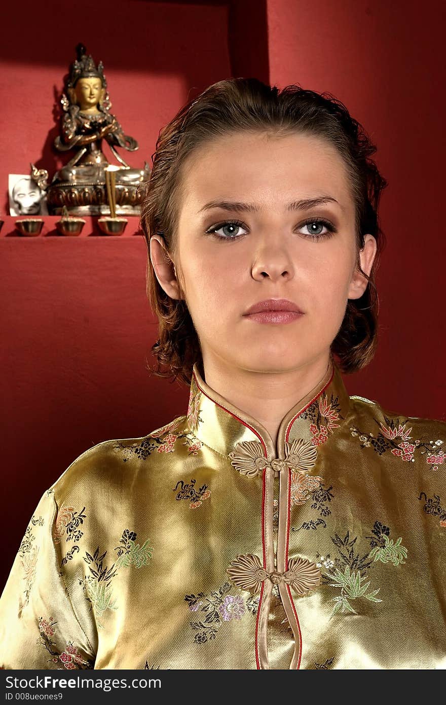 Girl, young woman meditating in a red room. Girl, young woman meditating in a red room