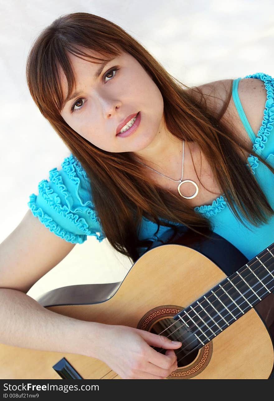 Woman playing guitar