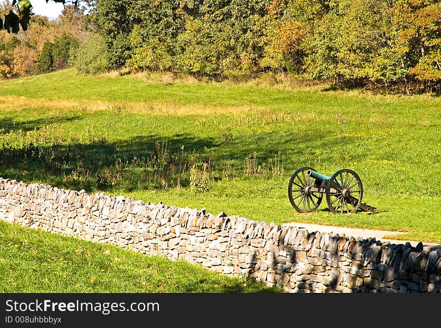 A lone Civil War cannon at Burnsides Bridge on the Antietam National Battlefield, Sharpsburg, Maryland on an autumn afternoon. A lone Civil War cannon at Burnsides Bridge on the Antietam National Battlefield, Sharpsburg, Maryland on an autumn afternoon