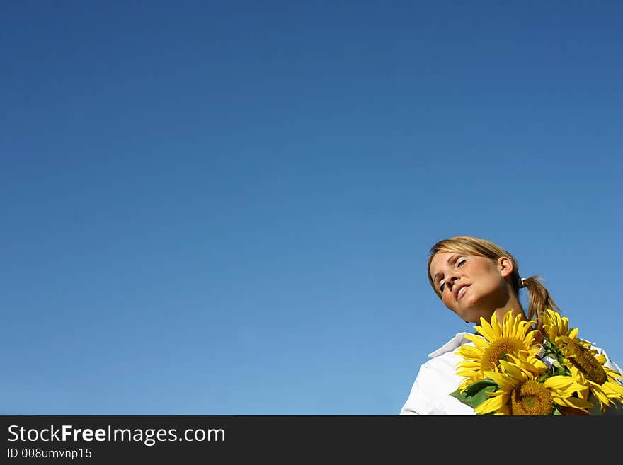 Beautiful Sunflower Woman and a blue sky.