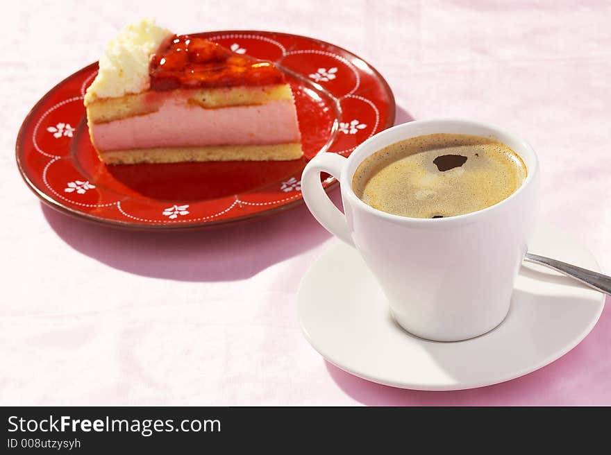 A cup of coffee and one  piece of strawberry cake. A cup of coffee and one  piece of strawberry cake