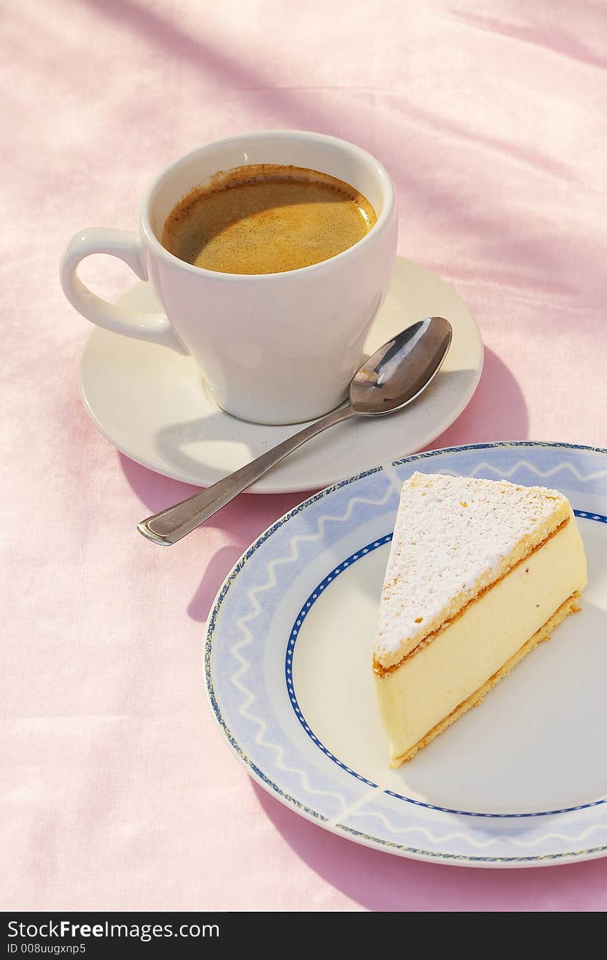 A cup of coffee and a piece of cheese cake. A cup of coffee and a piece of cheese cake