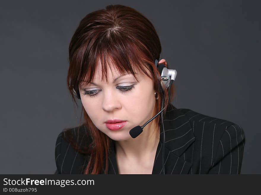 Girl with headset looking down