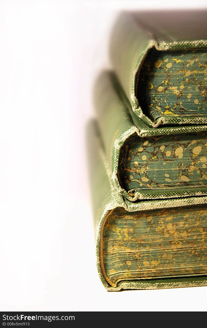 Three old books stacked with white background