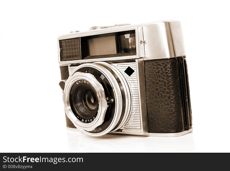 An old 35mm film camera isolated on white. An old 35mm film camera isolated on white