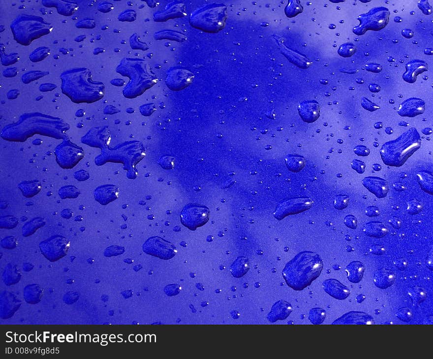 Rain drops on blue surface