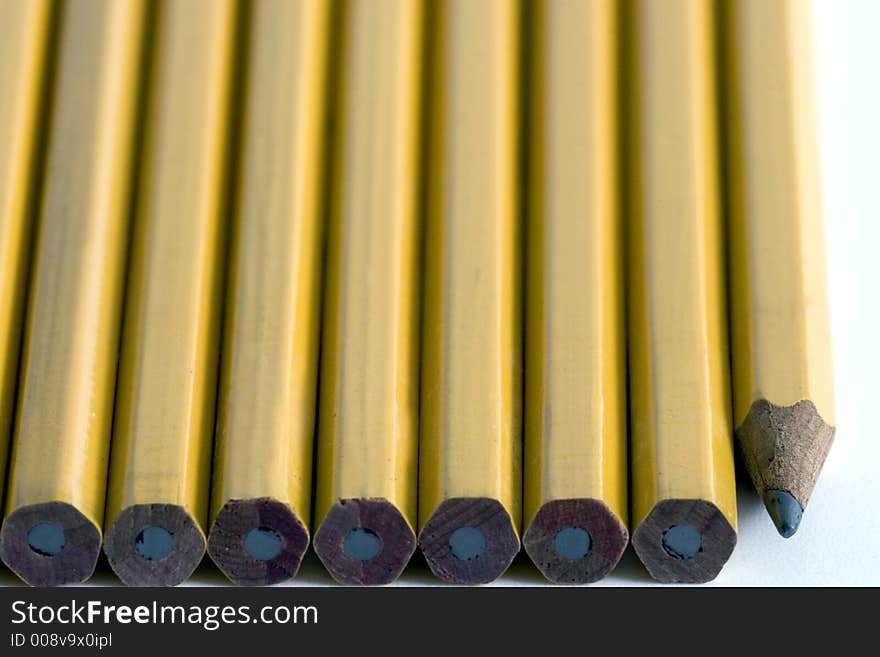 Wooden yellow pencils lined up