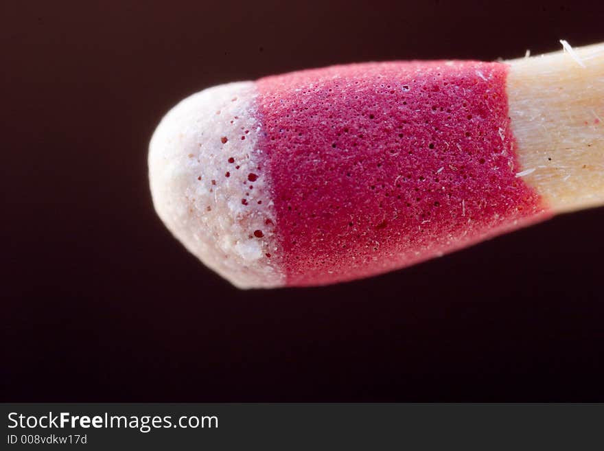 The business end of a stick match isolated on a black background. The business end of a stick match isolated on a black background.