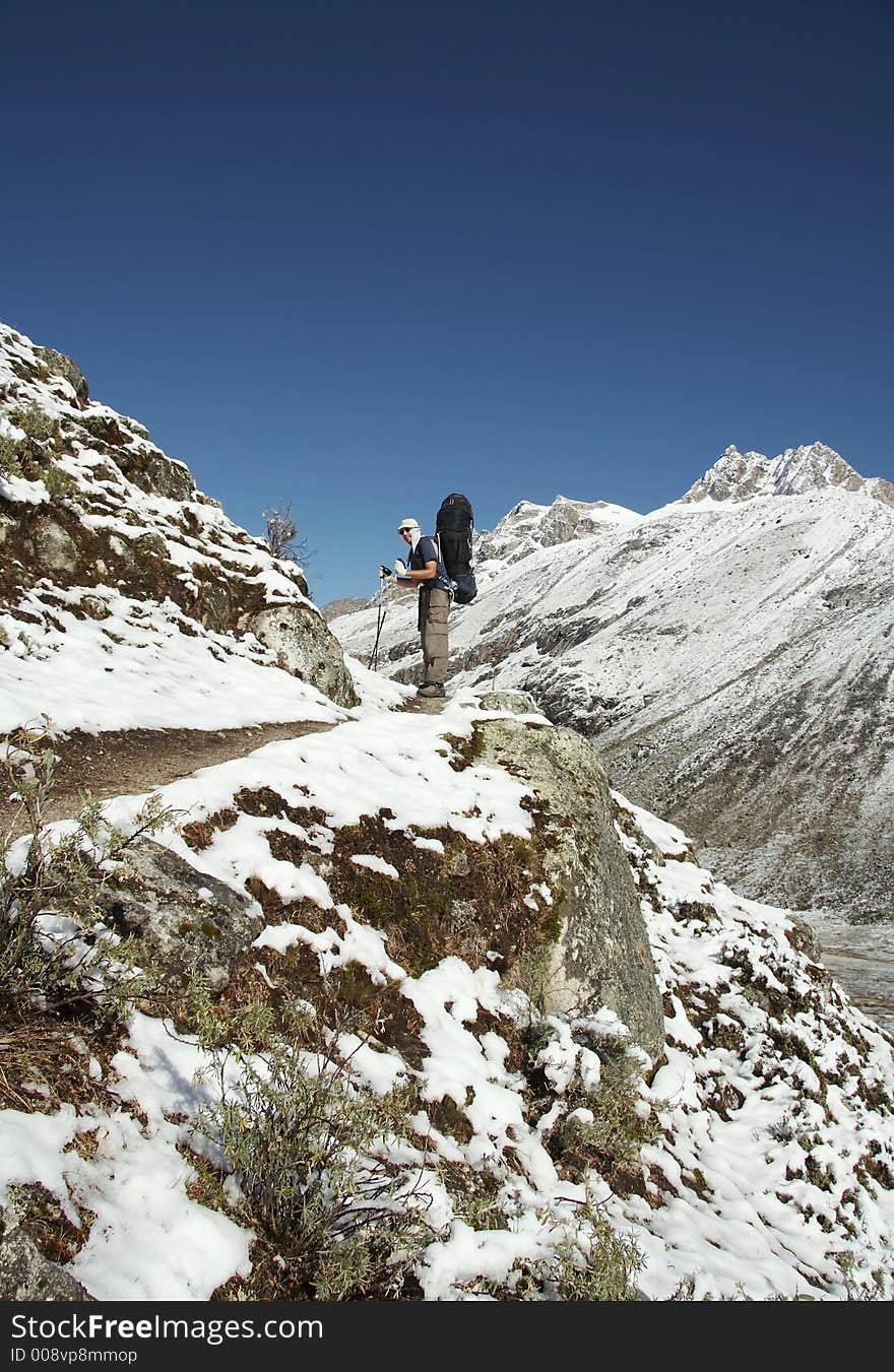 Going tourist in the snowcovered trail. Going tourist in the snowcovered trail