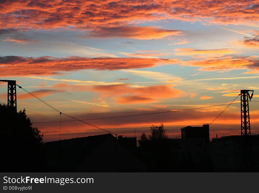 City panorama on a background of the scarlet morning sky