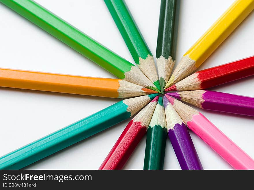 Thick colored pencils against a white background color