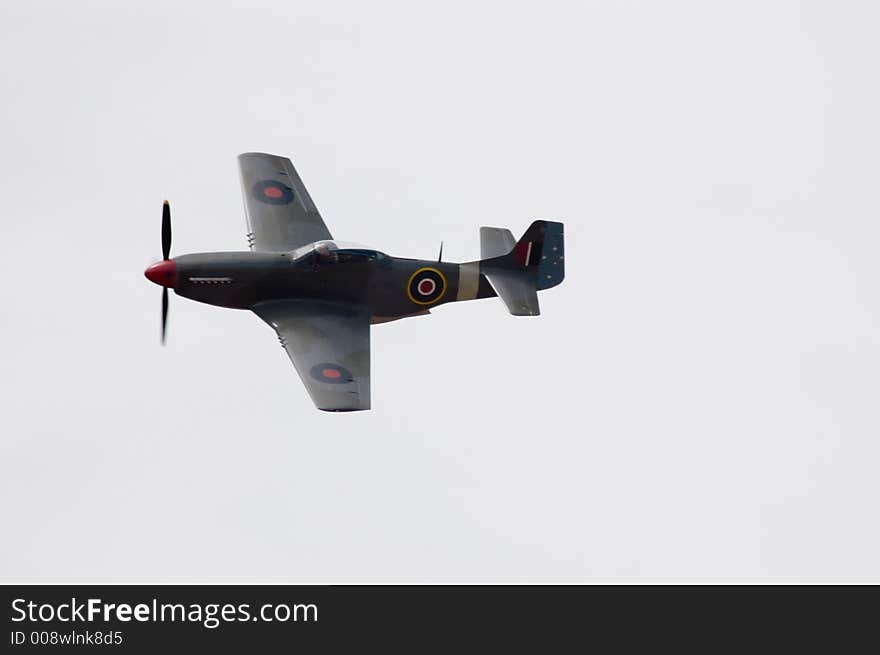 A 1947 CA-18 (similar to a P-51D Mustang) flies past at an airshow. This is an Australia built aircraft. A 1947 CA-18 (similar to a P-51D Mustang) flies past at an airshow. This is an Australia built aircraft.