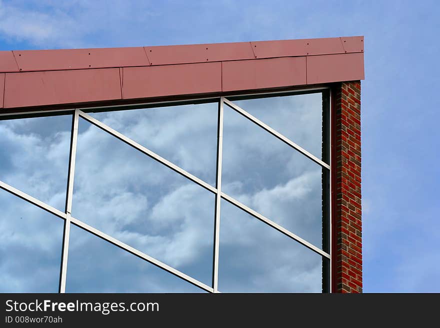 Modern building with sky reflectioons in the glass. Modern building with sky reflectioons in the glass