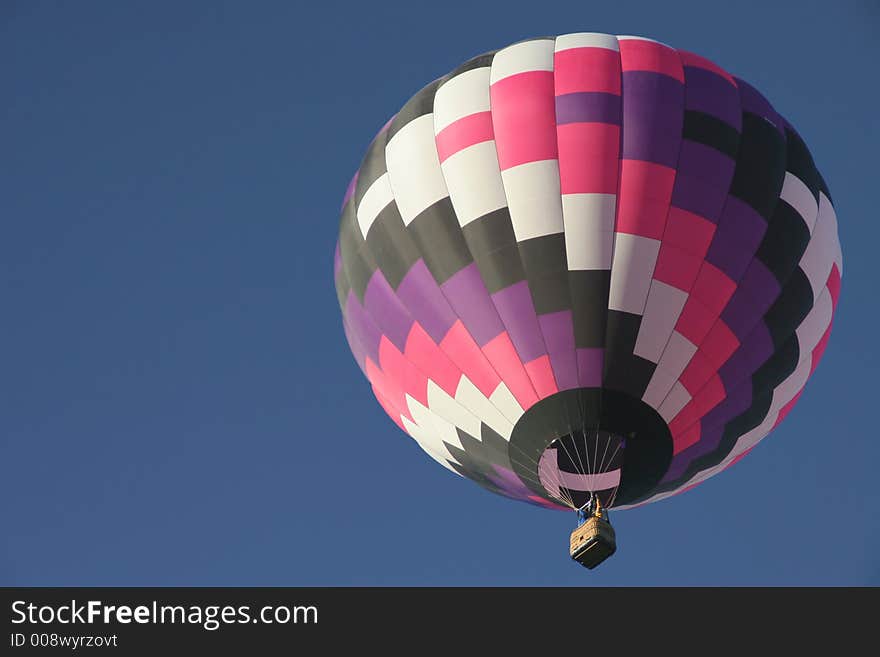 Colorful hot air balloon in clear sky with plenty of room for text. Colorful hot air balloon in clear sky with plenty of room for text