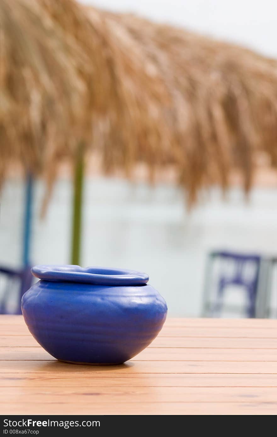 Blue handmade ashtray on table. Blue handmade ashtray on table