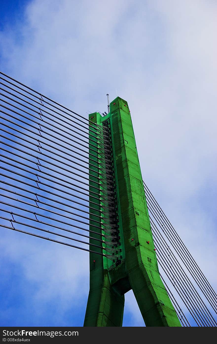 Modern Green Cable bridge closeup on blue sky