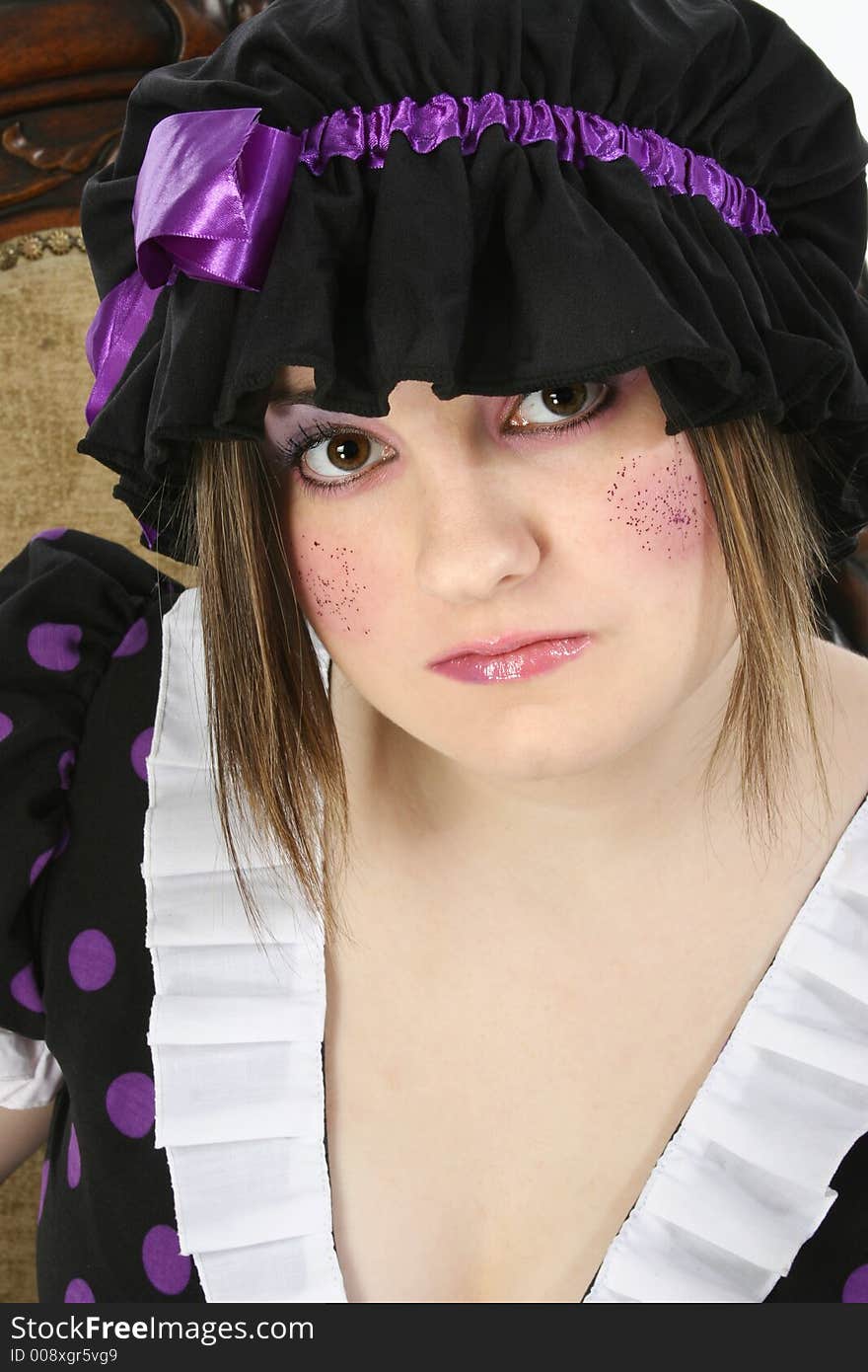 Beautiful fifteen year old teen girl dressed up in doll costume.  Glitter freckles on cheeks. Beautiful fifteen year old teen girl dressed up in doll costume.  Glitter freckles on cheeks.