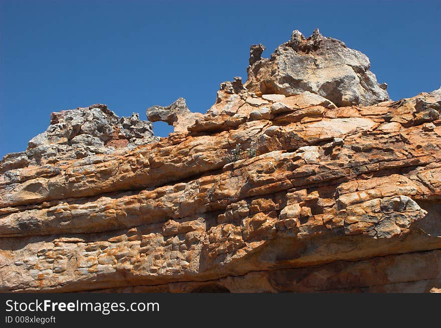 Rare rock formation with deep blue background