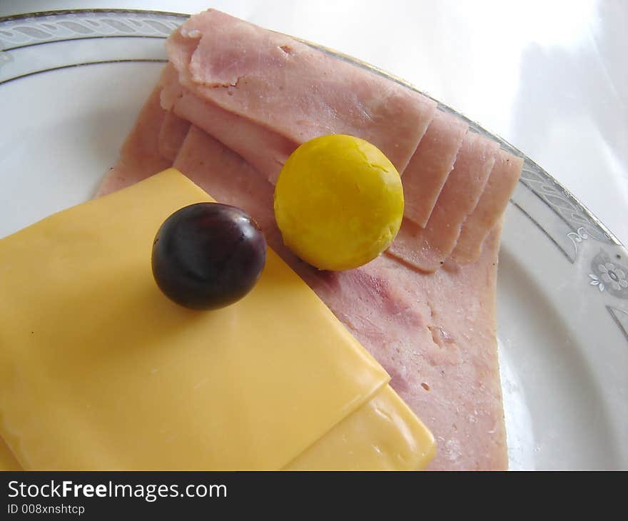 Gourmet dish with ham, cheese and olive. Gourmet dish with ham, cheese and olive