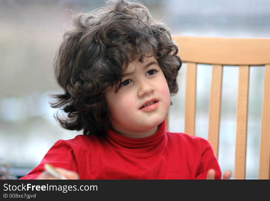 Child in red at dinner