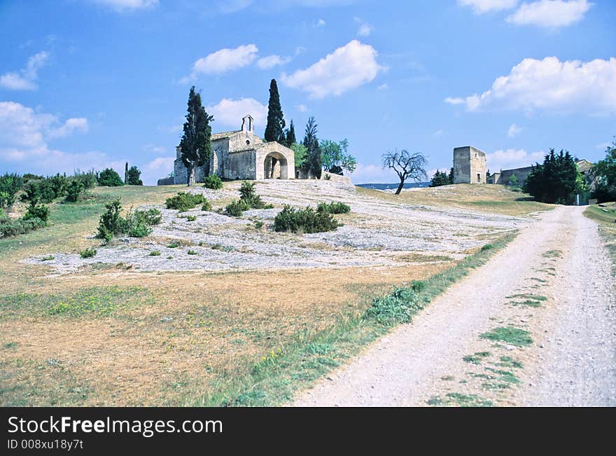 Landscape in provence, France, with a path and an antique disused chapel. Landscape in provence, France, with a path and an antique disused chapel