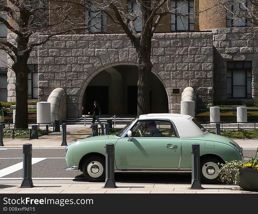 Retro car on the city street. Retro car on the city street