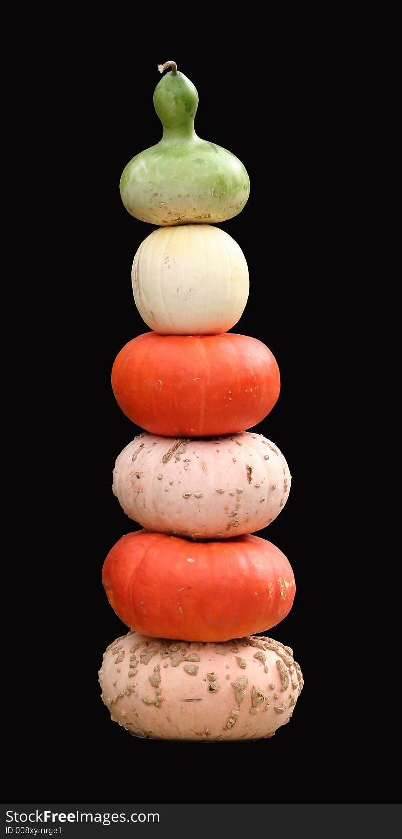 Interesting collection of pumpkins stacked by shape and size. Interesting collection of pumpkins stacked by shape and size.