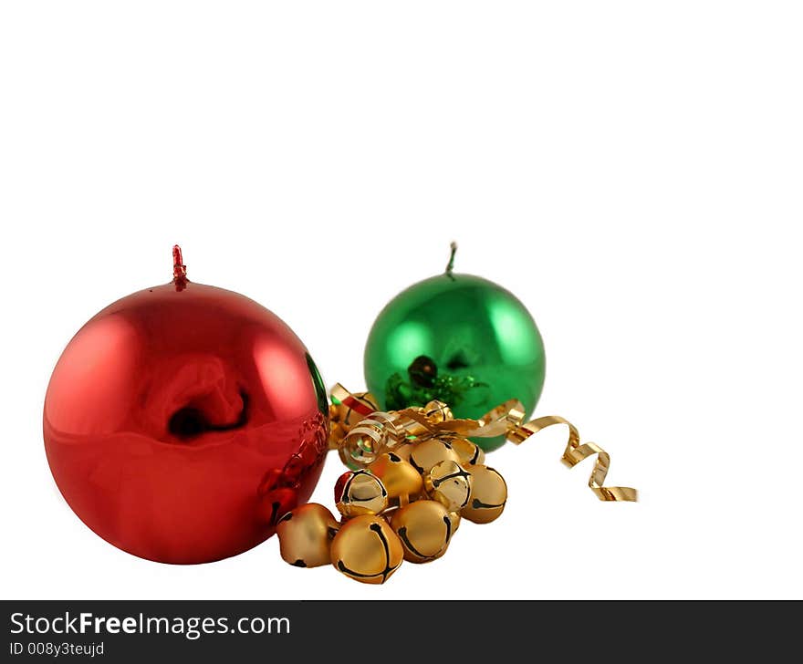 Red and green metallic Christmas candles with gold bells