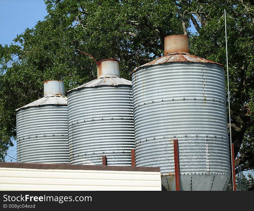 Storage, container, animal food stirage, trees, blue sky,. Storage, container, animal food stirage, trees, blue sky,