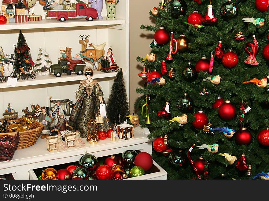 Cropped shot of a christmas tree dotted with decorations, and shelves full of all kinds of christmas items. Cropped shot of a christmas tree dotted with decorations, and shelves full of all kinds of christmas items