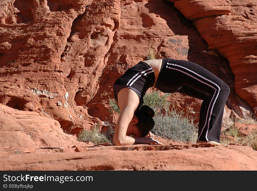 A girl doing yoga in Red Rock Canyon, Las Vegas Nevada. A girl doing yoga in Red Rock Canyon, Las Vegas Nevada