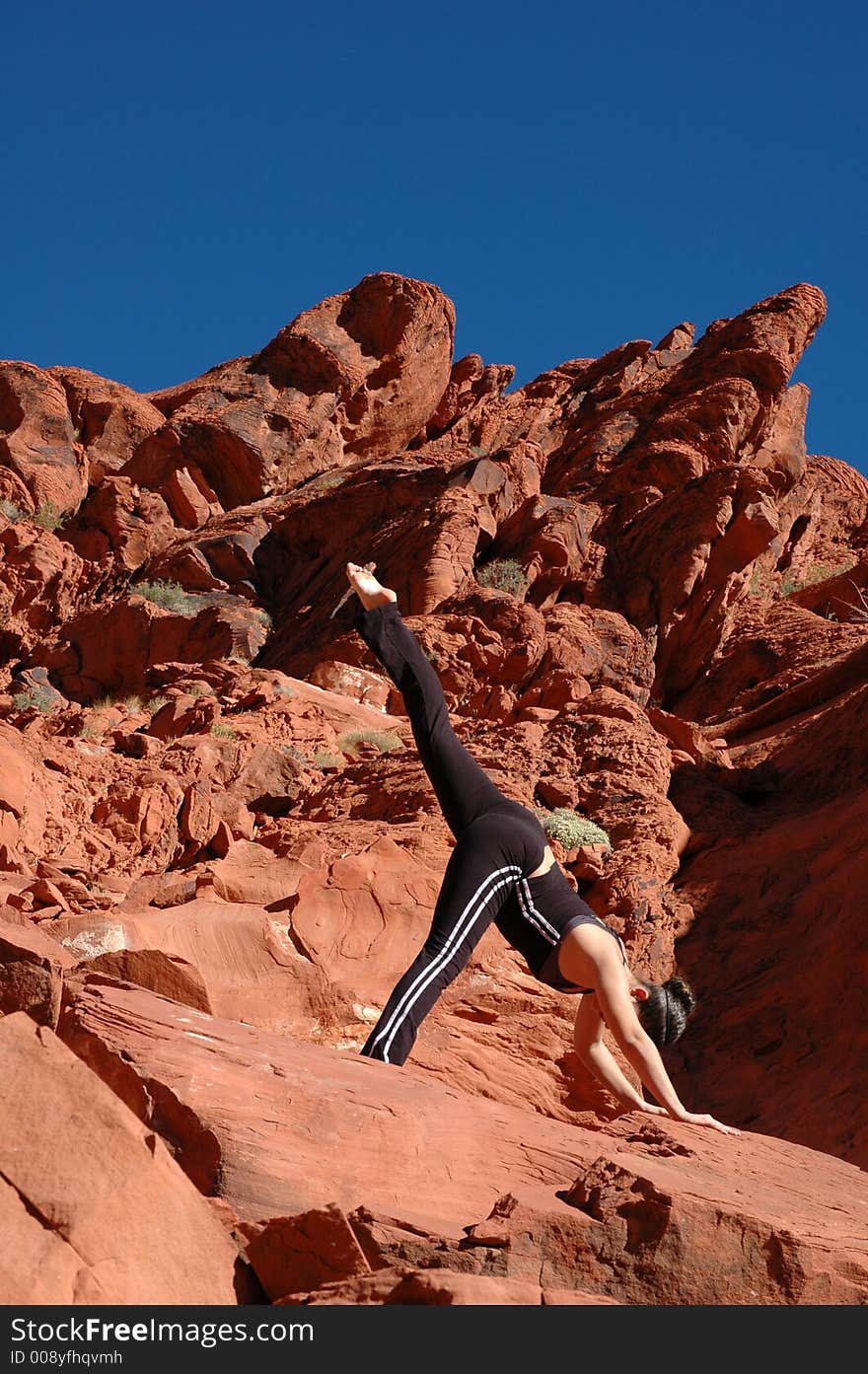 A girl doing yoga in Red Rock Canyon, Las Vegas Nevada. A girl doing yoga in Red Rock Canyon, Las Vegas Nevada