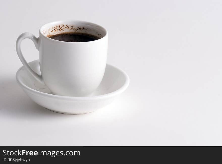 Cup of Coffee on white plate and white background