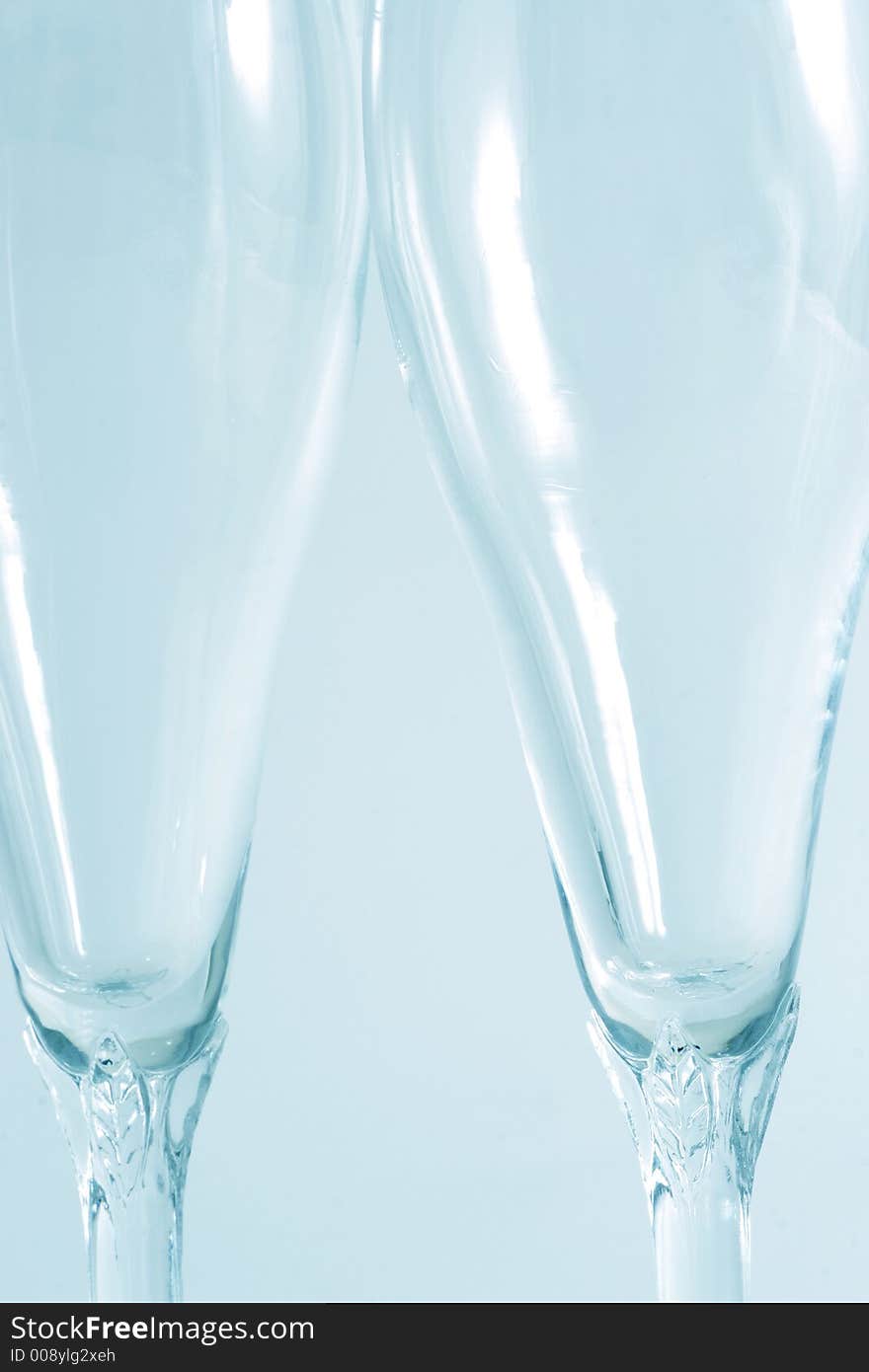 Two wine glass isolated over a blue background