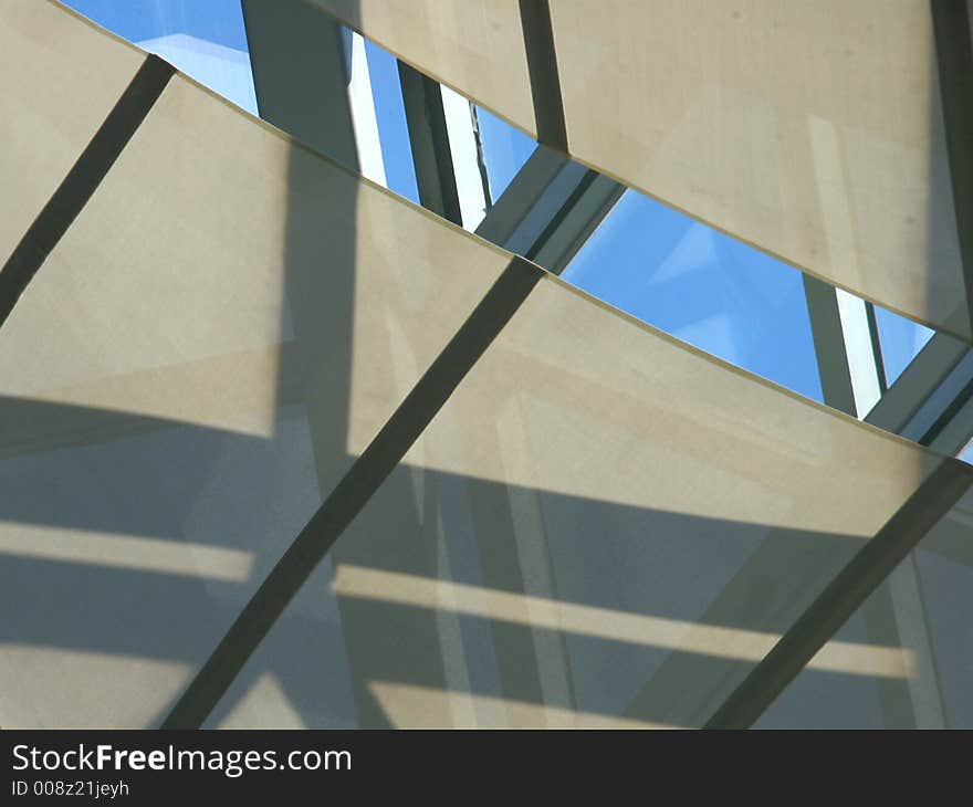 Abstract of shapes with reflected sky and shadows