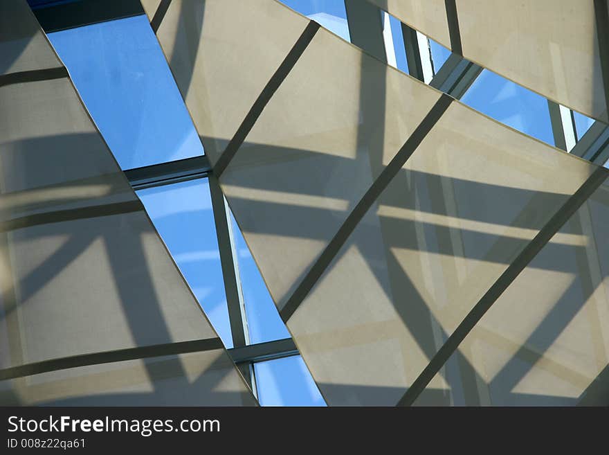 Abstract of shapes with reflected sky and shadows