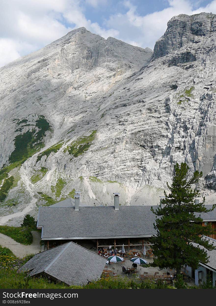 This alpine hut is not far from the peak of a mountain in the Bavarian Alps. Hikers enjoy their stop there to have lunch or just a beer. This alpine hut is not far from the peak of a mountain in the Bavarian Alps. Hikers enjoy their stop there to have lunch or just a beer.