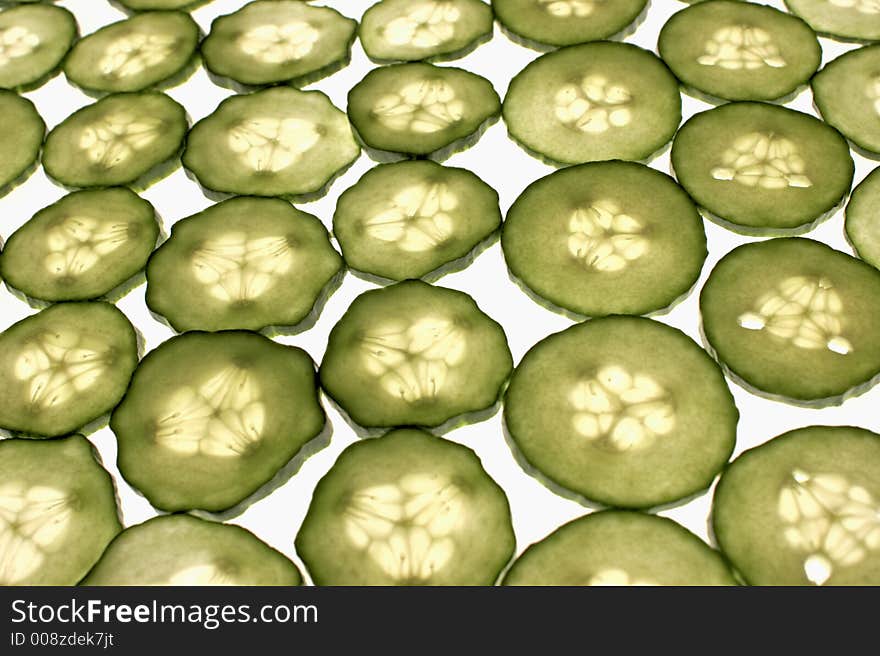 Cucumber sliced pattern on white background