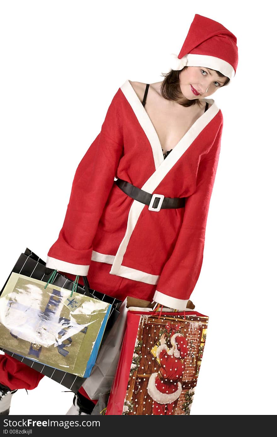 Young woman in  a red and white santa fancy dress with presents. Young woman in  a red and white santa fancy dress with presents