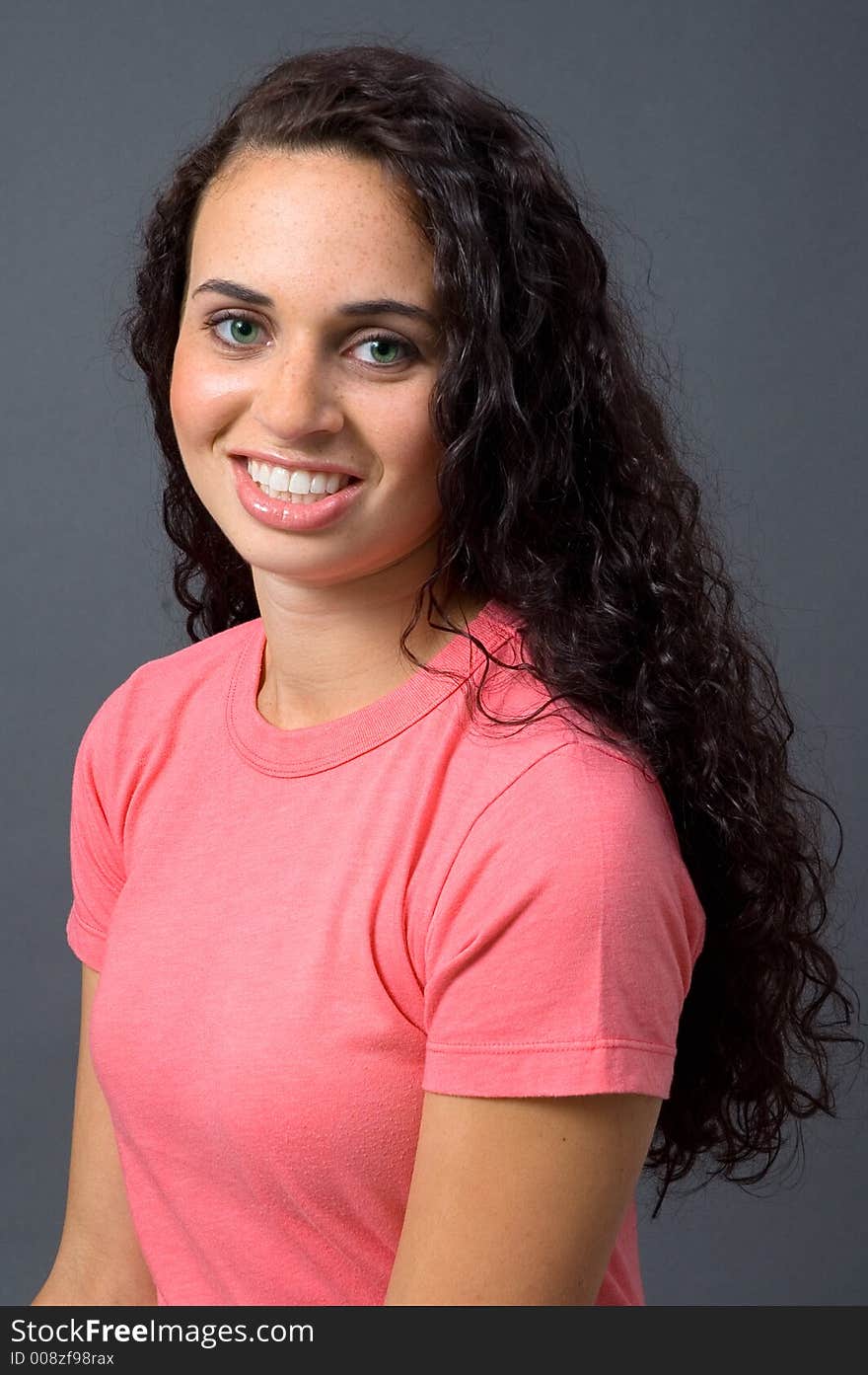 Green-Eyed Woman in Pink tee shirt