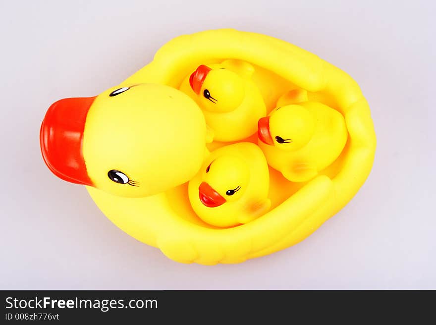 Yellowish rubber duck close up.