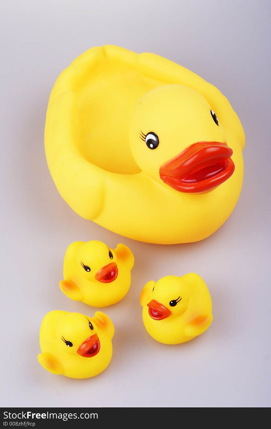 Yellowish rubber duck close up.