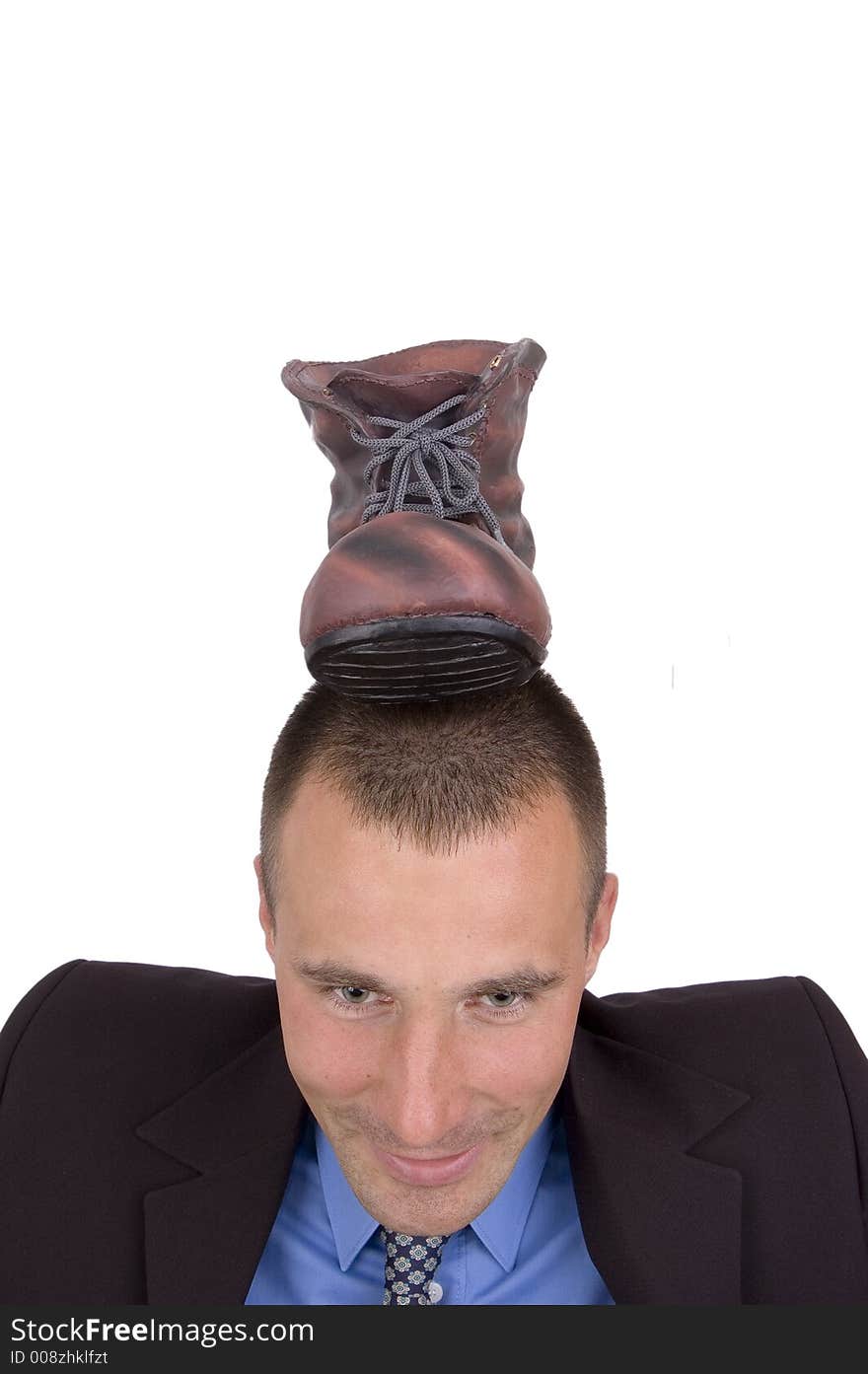 Young business man with a foot on head